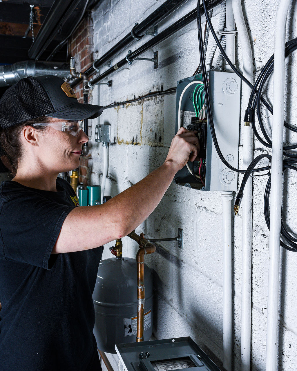Expert performing electrical panel repair
